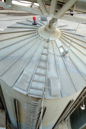 The 3DLevelScanner installed on a corrugated steel bin used for wood pellet storage.