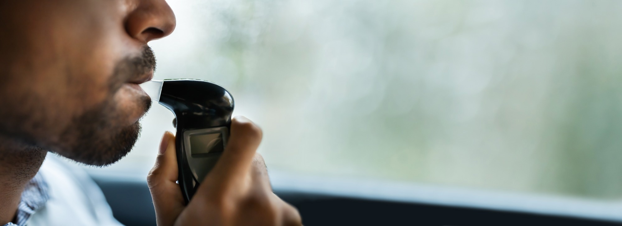 Man Taking Breath Test.
