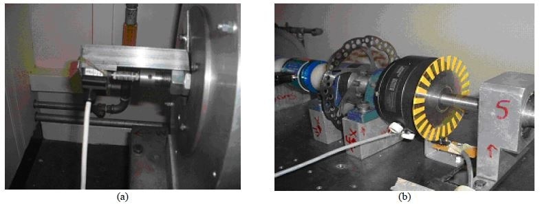 Photograph of the speed encoder for (a) flywheel and (b) dynamometer