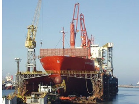 Front views. Ships being repaired resting on the dock’s working surface.