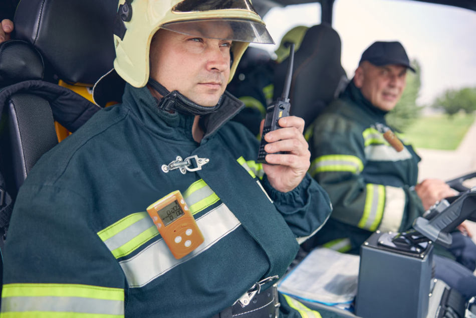 Firefighter using SENKO’s MGT-P portable multi gas detector.