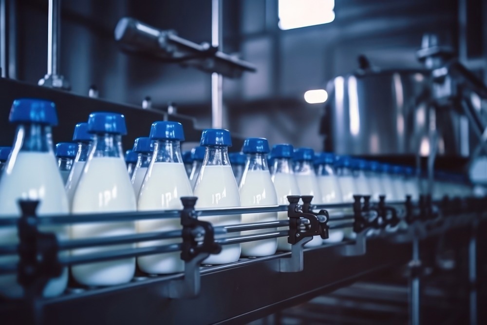 Milk factory. Robotic factory line for processing and bottling of milk.