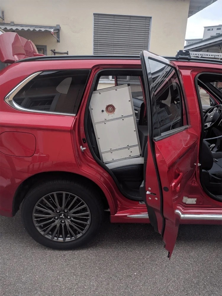 Vocus Elf PTR-TOF installed in a vehicle. A PFA sampling tube attached to a longitudinal roof sampling probe (visible in the upper right corner of the image) was connected to the instrument inlet and small external pump.