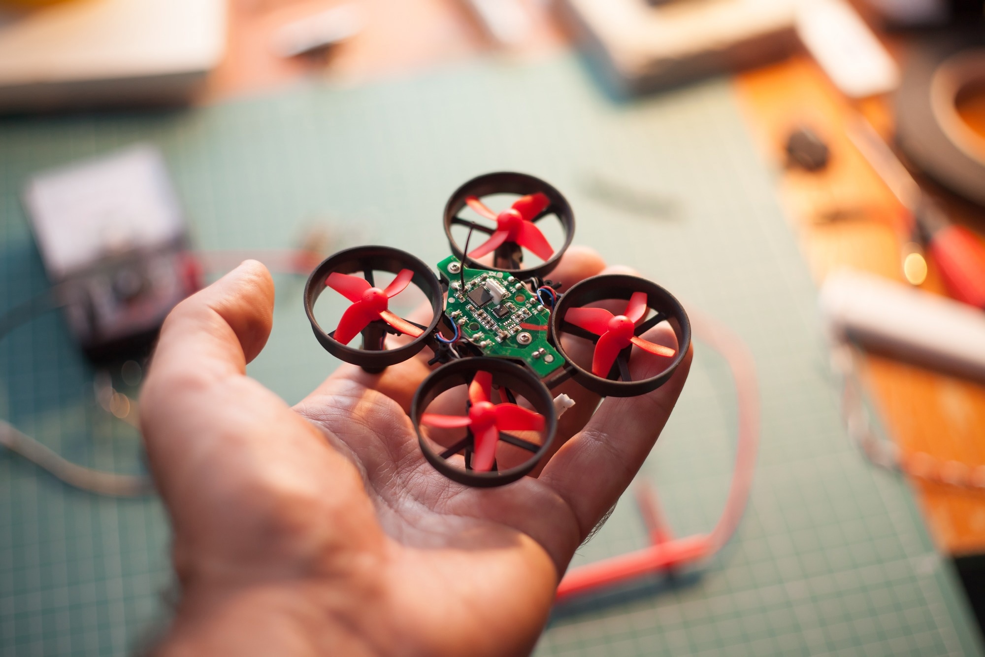 micro drone in hand.