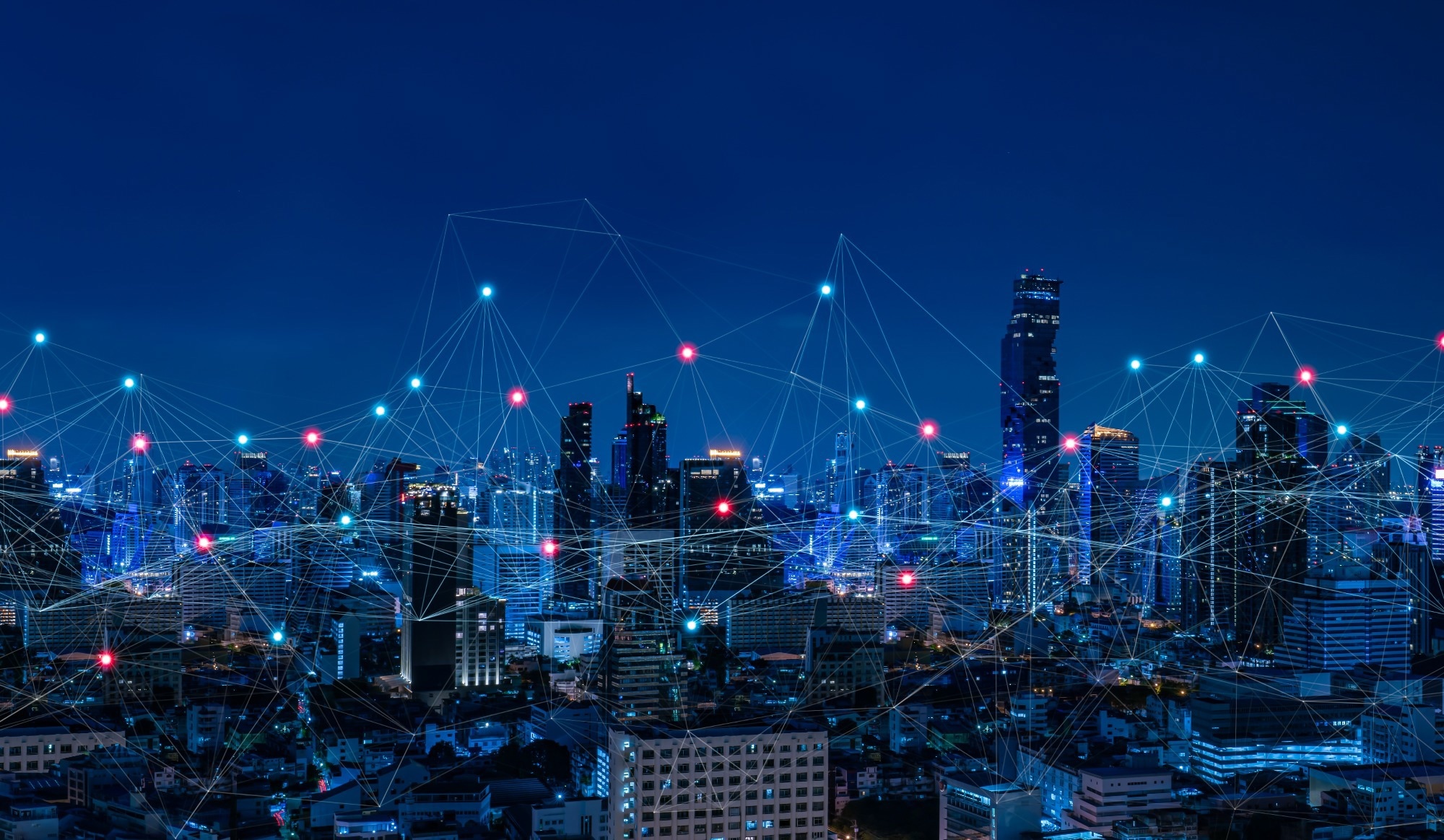 Modern city with wireless network connection and city scape concept.Wireless network and Connection technology concept with city background at night.