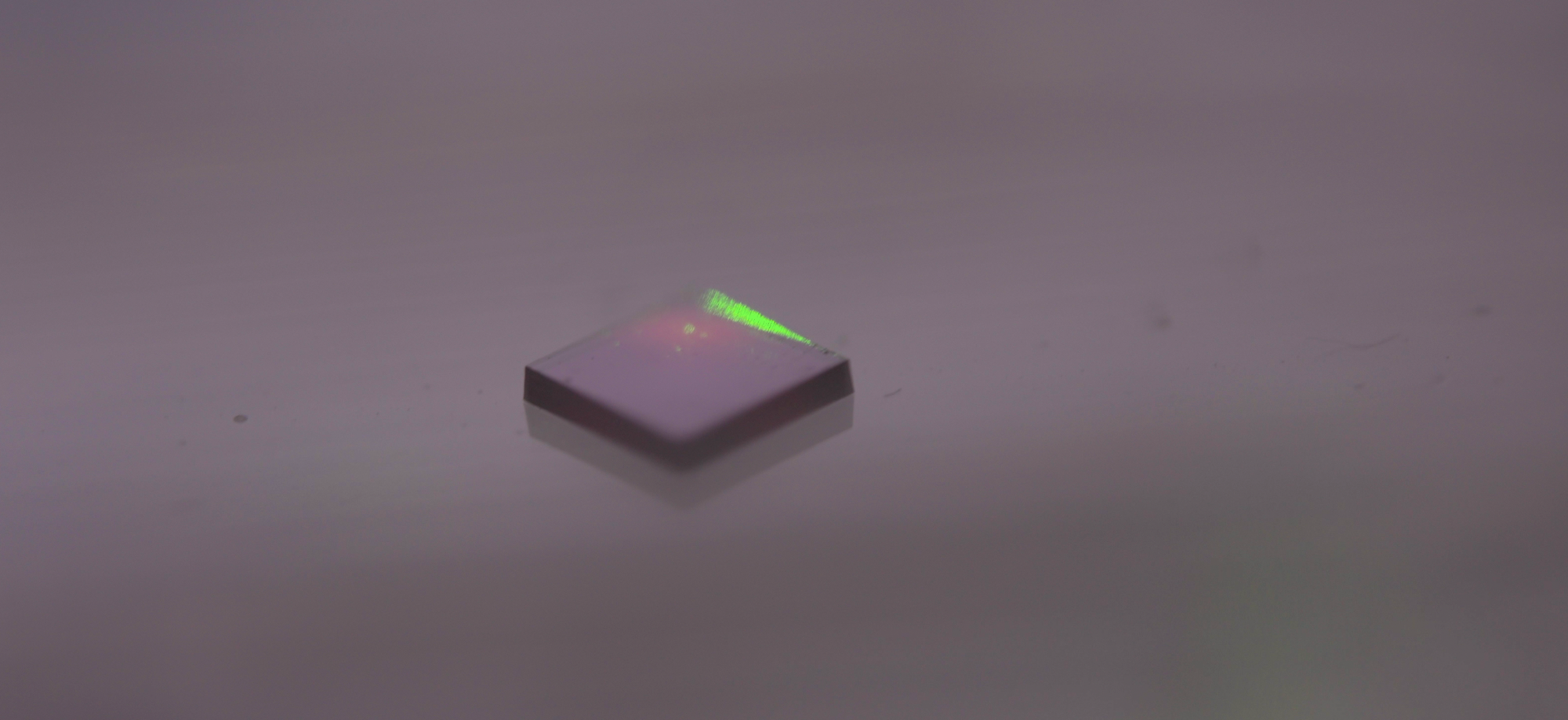 Image of the diamond material with a lazer directed at it.