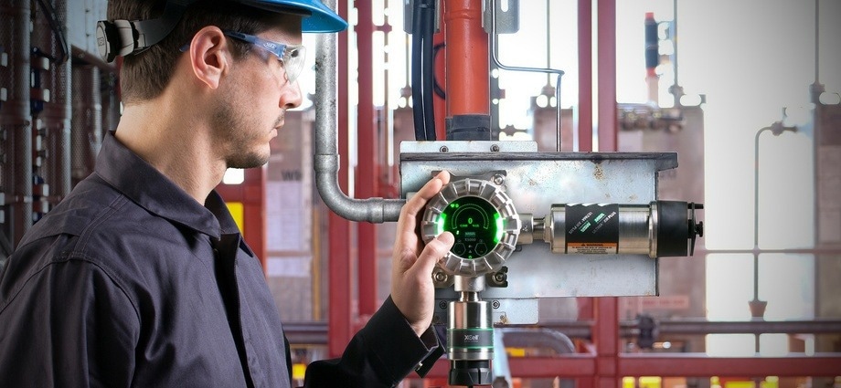 Male engineer operating a fixed gas detection system