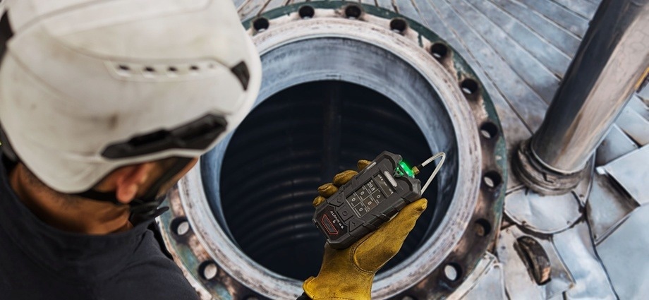Engineer operating a portable gas sensor