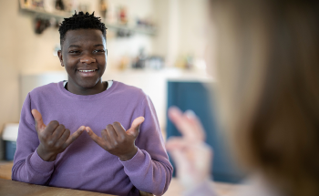Translating Sign Language into Voice and Text Using Sensors