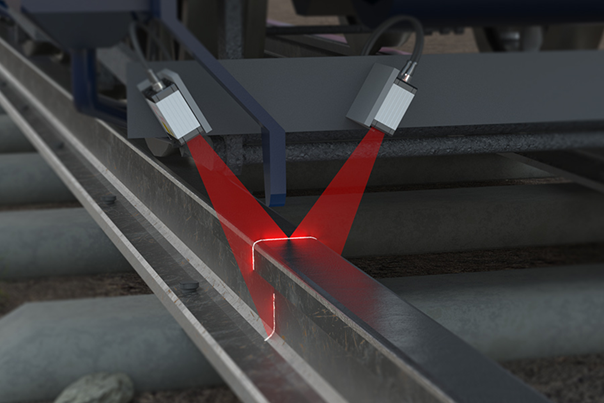 The laser scanCONTROL beams cut across a steel beam.
