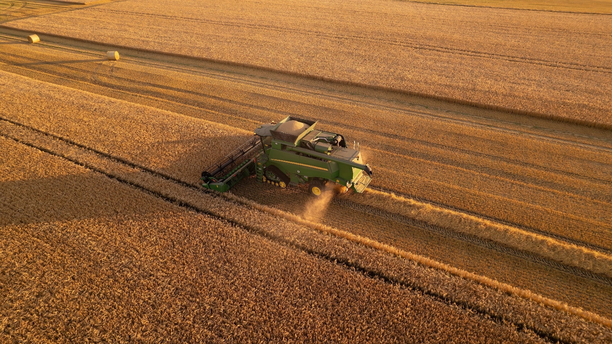 Aerial view of combine harvester at work.