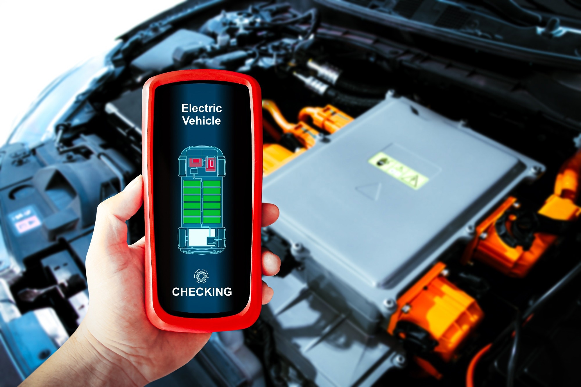 Car technician checking electric vehicle system problems with a wireless scan tool.