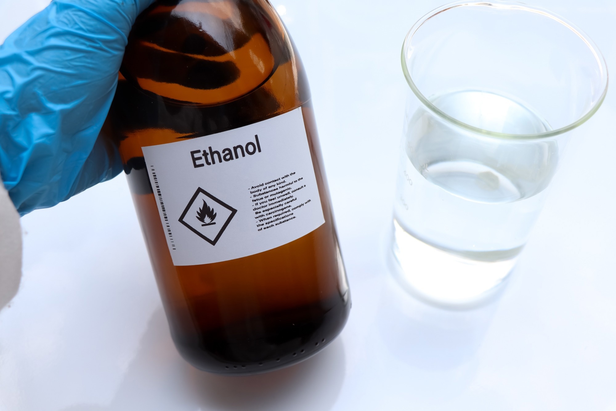 Ethanol in glass,Hazardous chemicals and symbols on containers in industry or laboratory.