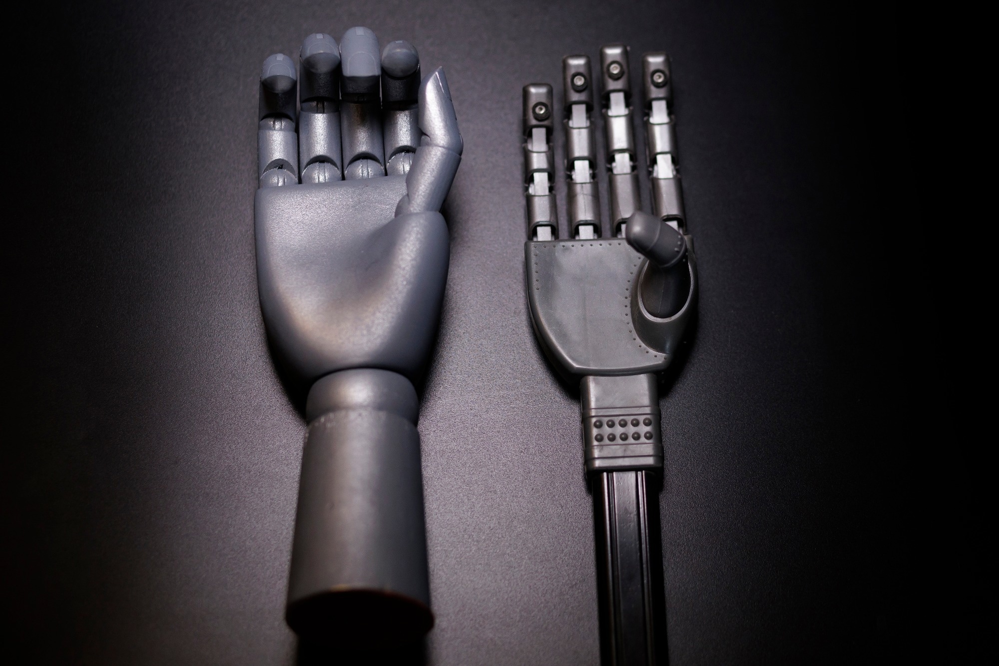 two robotic hands showcasing advanced design and functionality in modern technology.