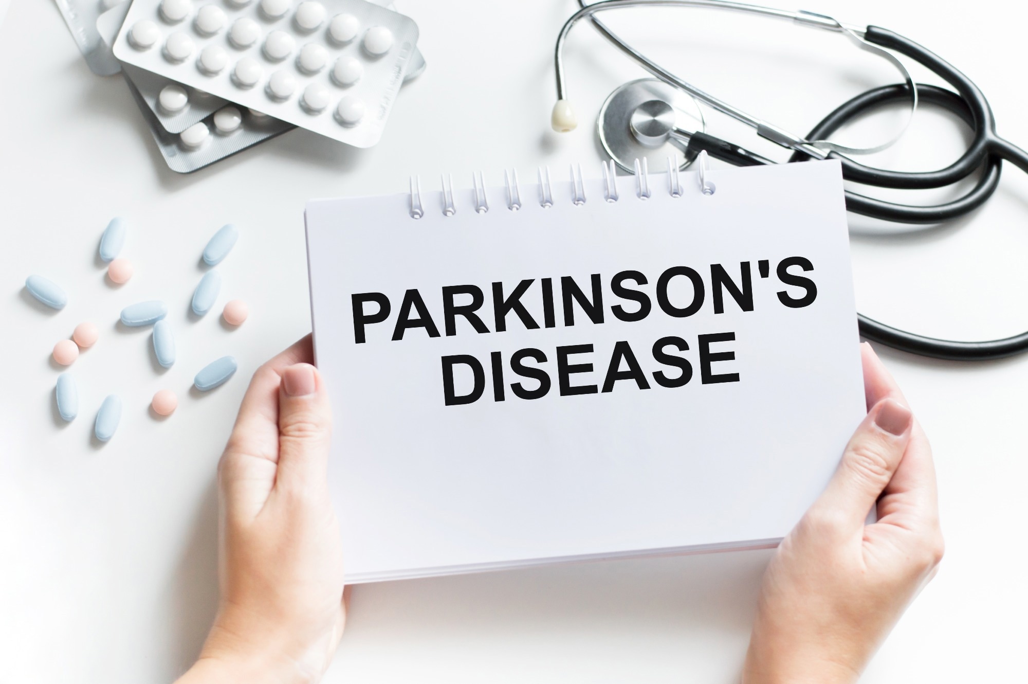 Doctor showing paper with PARKINSON