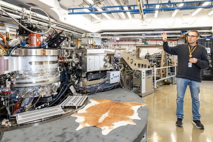 Georgi Dakovski, SLAC lead scientist and qRIXS instrument lead, stands beside the qRIXS instrument
