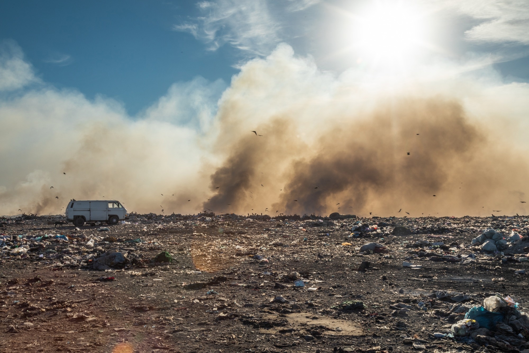 Burning rubbish producing toxic gases.