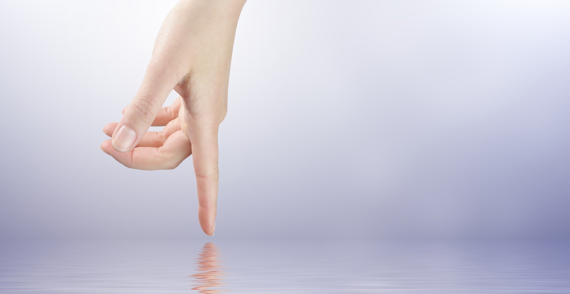 A hand touches water to convery sensing response to tactile feedback.