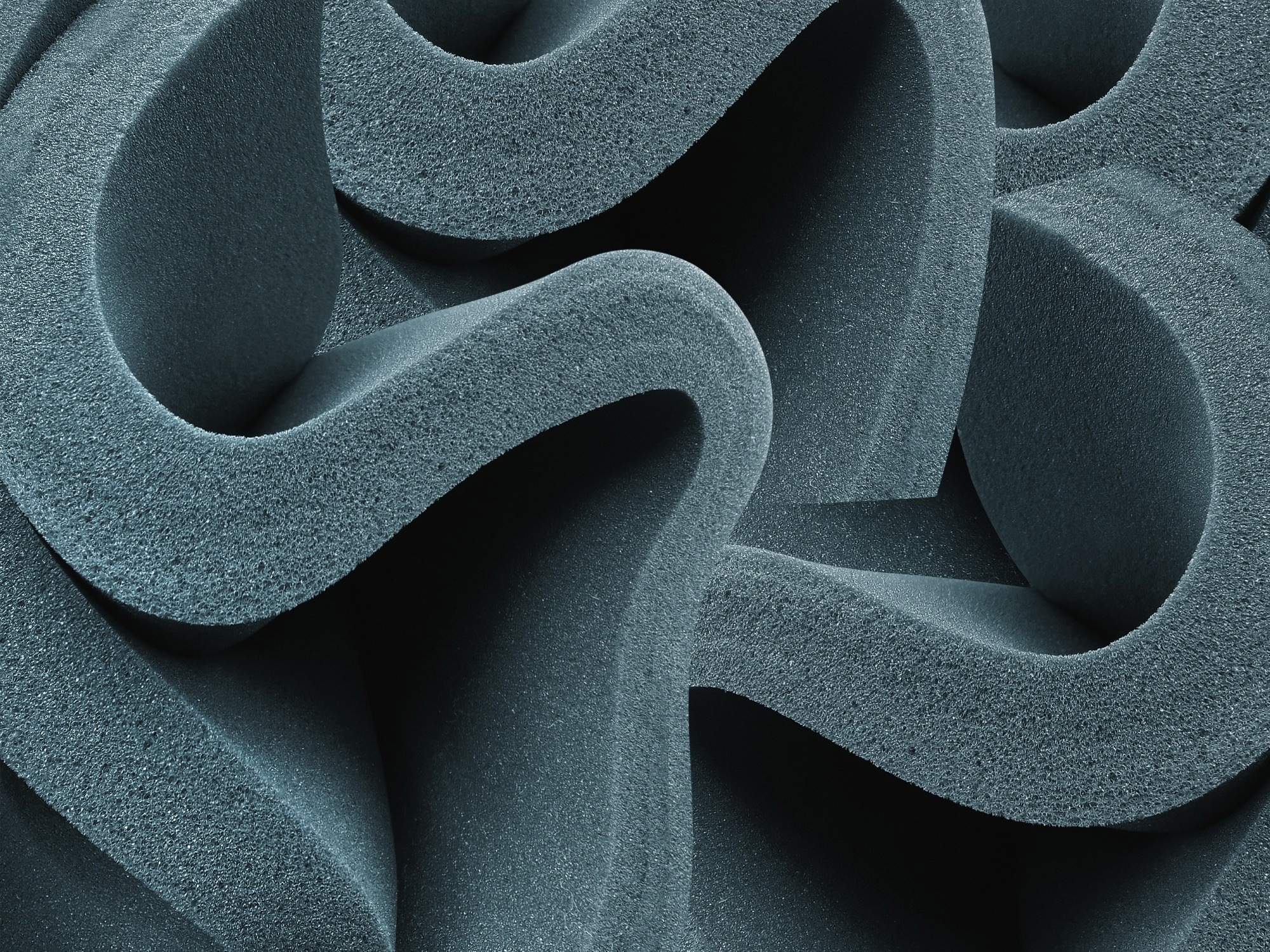 curved sponge foam sheet. texture of bluish gray material
