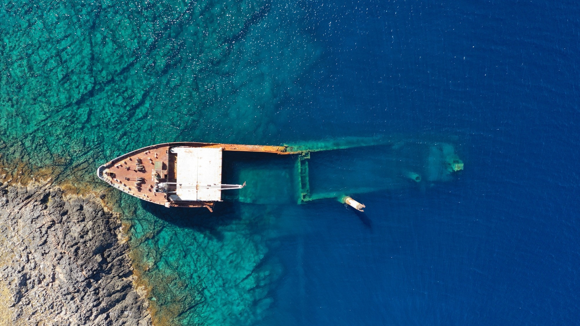 Aerial drone photo of famous shipwreck of "Nordland" half sunk ship in islet of Prasonisi near Diakofti main port of Kithira island, Ionian, Greece