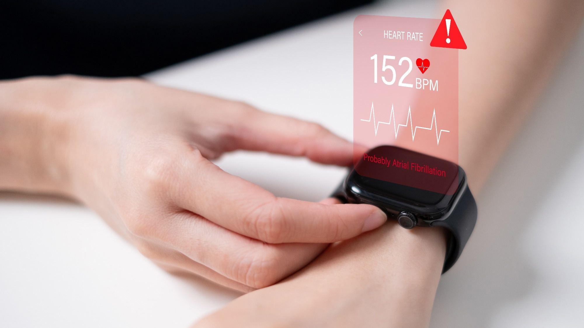 Smart watch with a graphic showing detected heartbeat from the person wearing the smartwatch.
