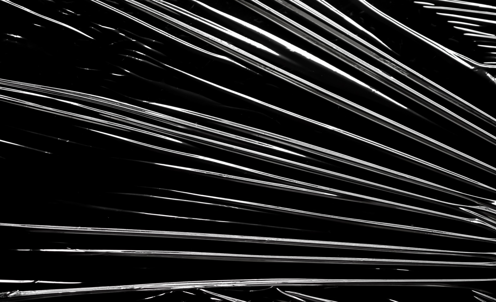 Plastic stretched across a black screen.