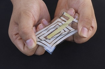 Adhesive Sensor Sticks to Skin and Monitors Health