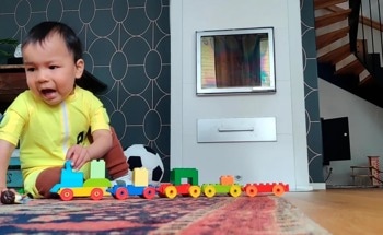 A Smart Jumpsuit With Motion Sensors Can Track Neurological Development of Infants